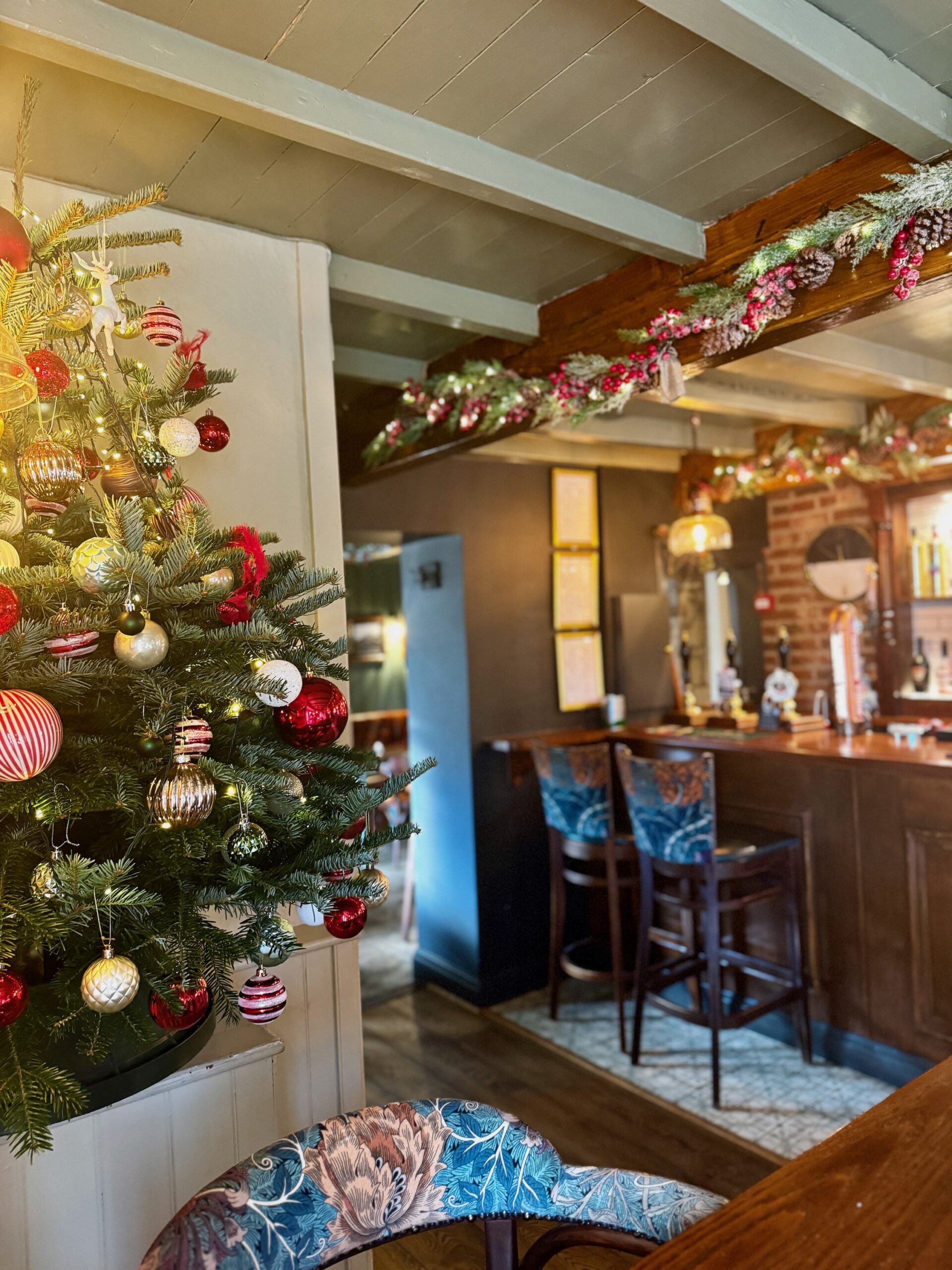 The Farmers Boy bar decorated for Christmas with tree, garlands and lights