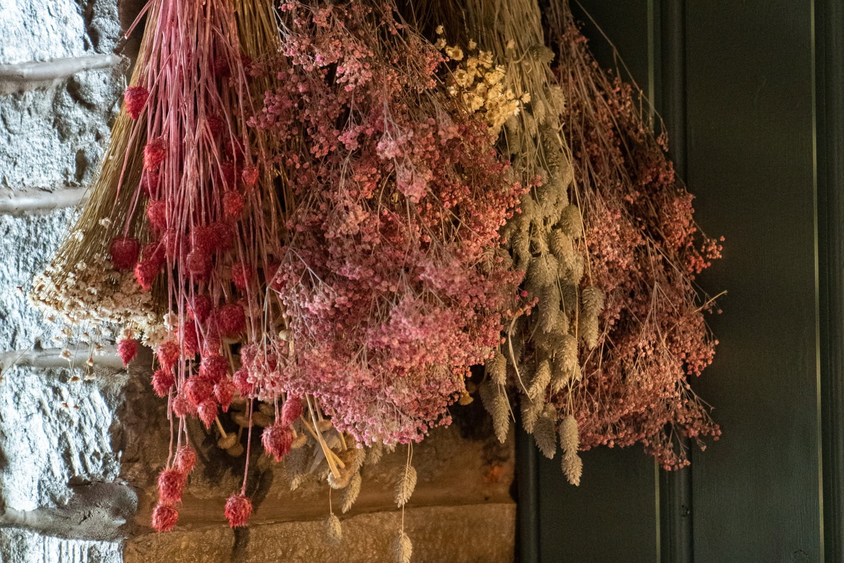 Hanging dried floral bunches in pinks and neutrals at The Farmers Boy, Shepley